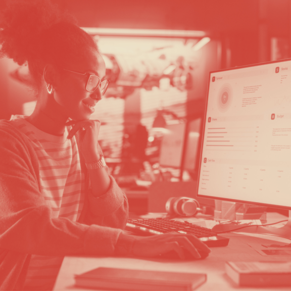 Black woman looking at computer