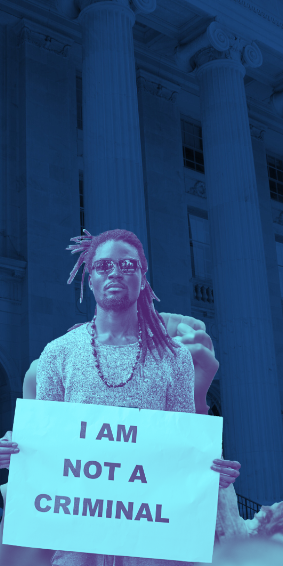 Blue courthouse background with three people at a protest